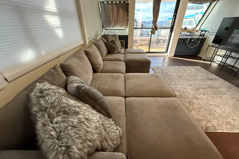 Slide: The Image of Luxurious interior of 2006 Fun Country 5014 SunCountry Arizona Edition houseboat with plush seating. - 7