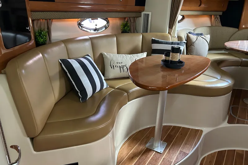 Slide: The Image of Luxurious interior of 2007 Chaparral 330 Signature with leather seating and elegant wooden table. - 11