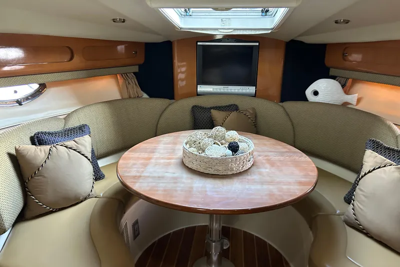 Slide: The Image of Luxurious 2007 Chaparral 330 Signature yacht interior with cozy seating and elegant decor. - 13