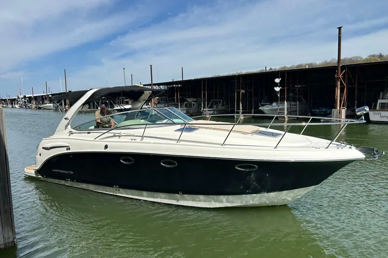 Slide: The Image of 2007 Chaparral 330 Signature boat docked in marina under blue sky. - 3
