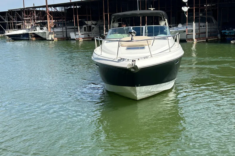 Slide: The Image of 2007 Chaparral 330 Signature boat docked on calm water. - 4