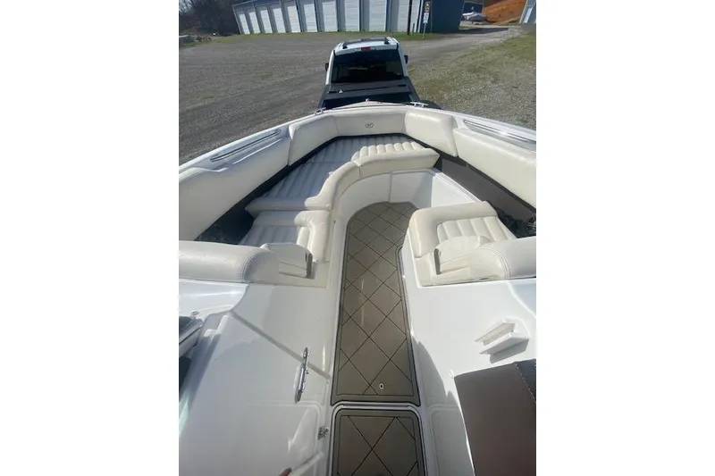 Slide: The Image of 2015 Cobalt R5 boat interior with white seating and diamond-patterned flooring. - 10