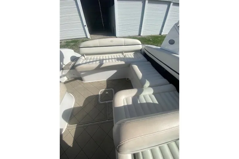 Slide: The Image of 2015 Cobalt R5 boat interior with white leather seating and spacious layout. - 14
