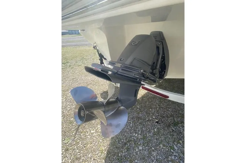 Slide: The Image of 2015 Cobalt R5 boat with a dual propeller outdrive on gravel surface. - 18