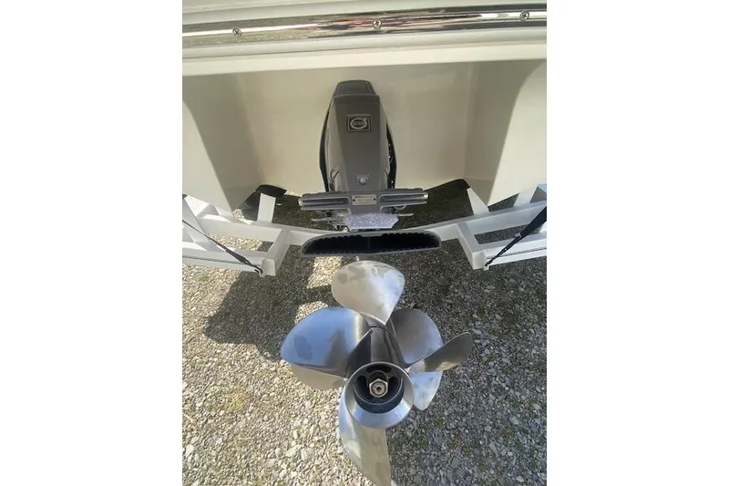 Slide: The Image of 2015 Cobalt R5 boat propeller and stern drive on gravel surface. - 19