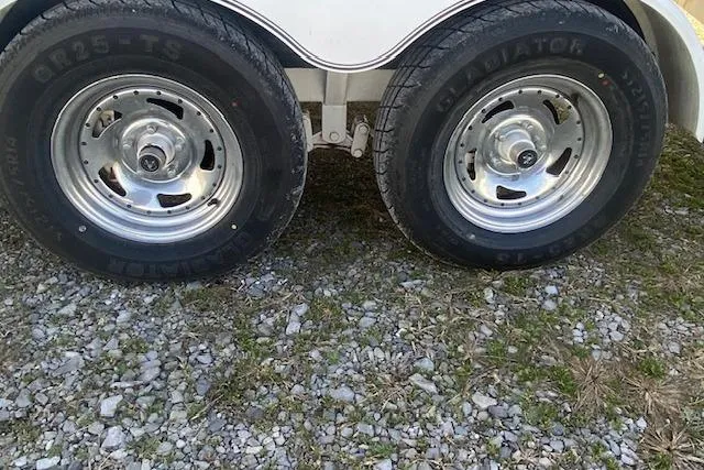 Slide: The Image of 2015 Cobalt R5 trailer wheels on gravel surface. - 23