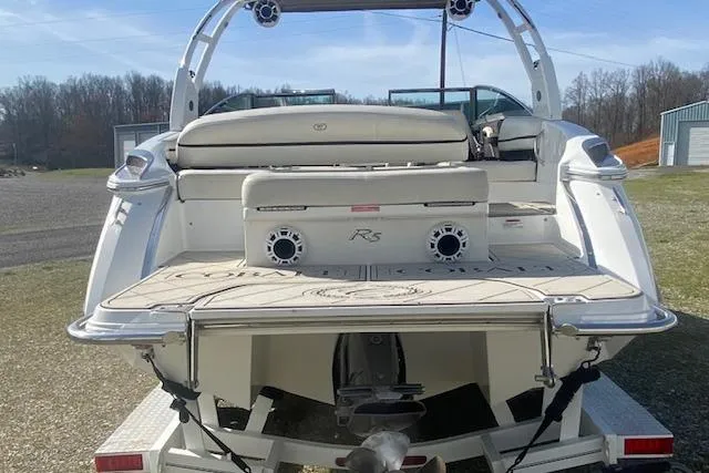 Slide: The Image of 2015 Cobalt R5 boat rear view on trailer, showcasing swim platform and seating. - 4