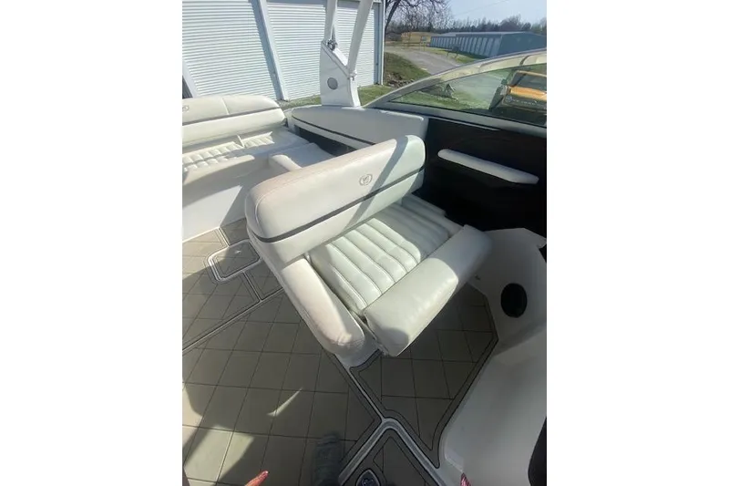 Slide: The Image of 2015 Cobalt R5 boat interior with white leather seating and modern design. - 6
