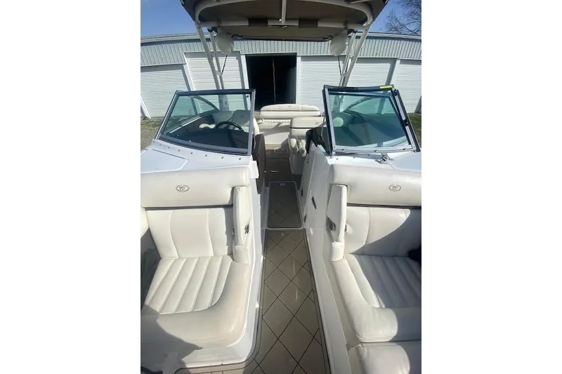 Slide: The Image of 2015 Cobalt R5 boat interior with white seating and open cockpit view. - 8