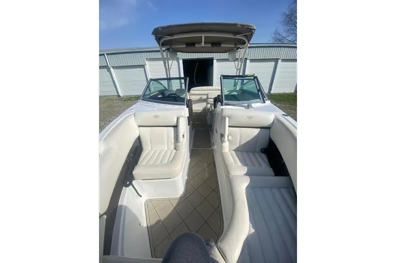 Slide: The Image of 2015 Cobalt R5 boat interior with white seating and open cockpit. - 9