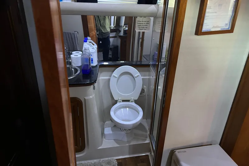 Slide: The Image of 1989 Carver 380 Santego yacht docked at marina, view from helm. - 11