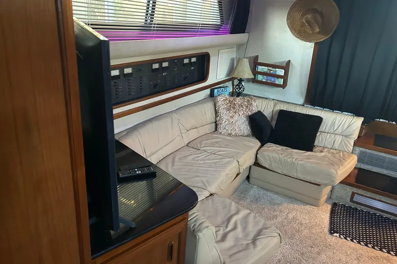 Slide: The Image of Cozy cabin interior of 1989 Carver 380 Santego with nautical-themed bedding. - 12