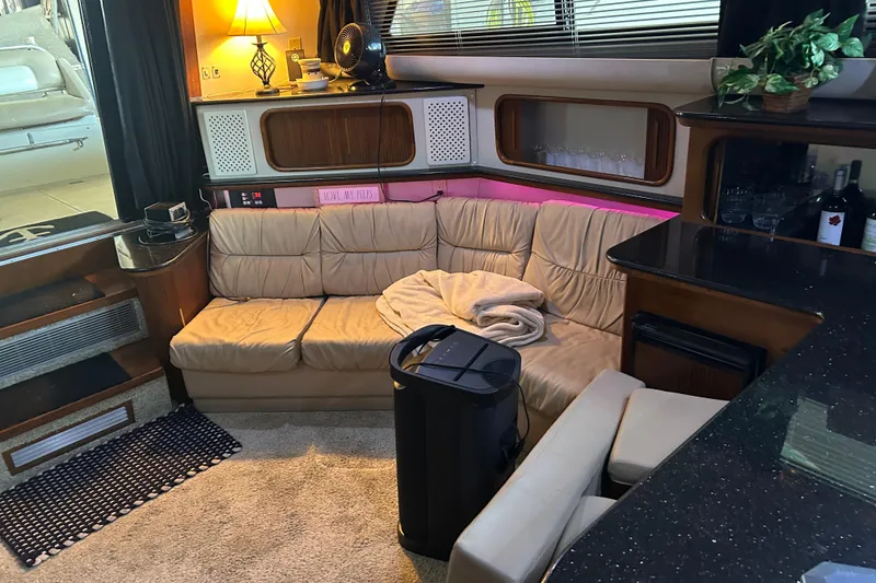 Slide: The Image of Luxurious interior of 1989 Carver 380 Santego yacht with cozy seating and modern amenities. - 13