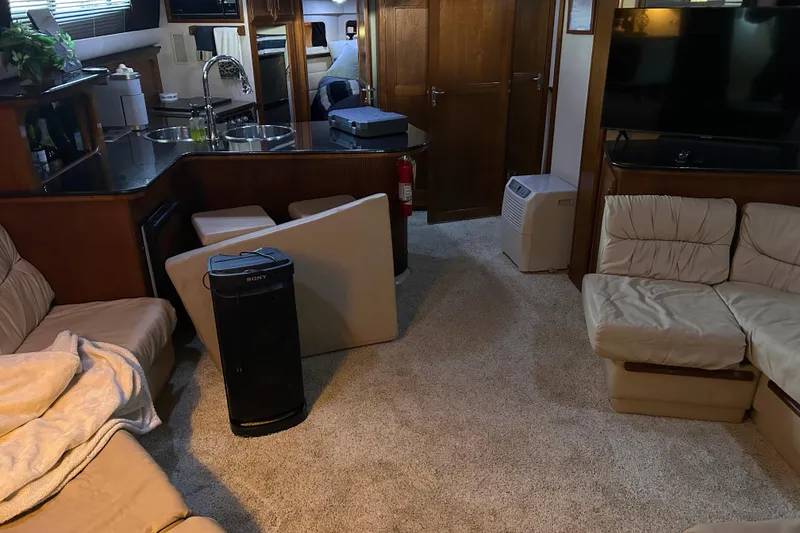 Slide: The Image of 1989 Carver 380 Santego yacht kitchen with dual sinks, stove, and refrigerator. - 14