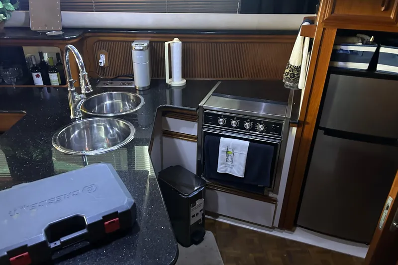 Slide: The Image of Luxurious interior of 1989 Carver 380 Santego yacht with cozy seating and modern amenities. - 16