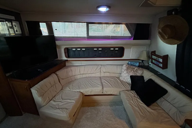 Slide: The Image of Interior of 1989 Carver 380 Santego yacht with cozy seating and modern amenities. - 18
