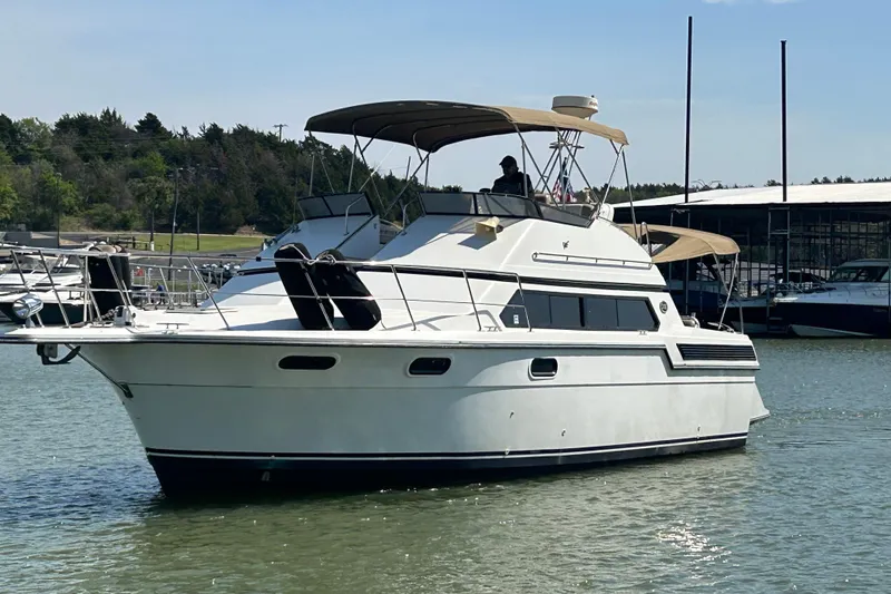 Slide: The Image of Interior of 1989 Carver 380 Santego yacht with cozy seating and ambient lighting. - 23