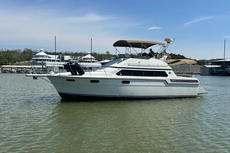 Slide: The Image of Luxurious 1989 Carver 380 Santego yacht interior with modern kitchen and bar area. - 24