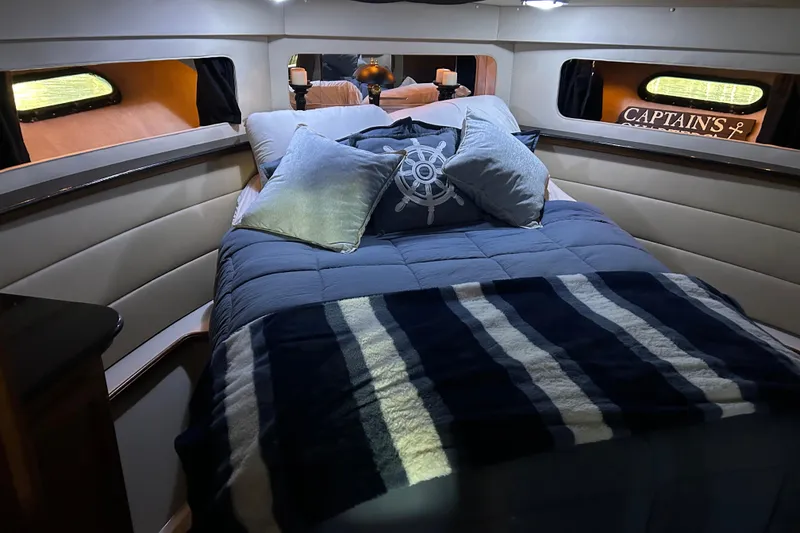 Slide: The Image of 1989 Carver 380 Santego yacht docked in a covered marina. - 8