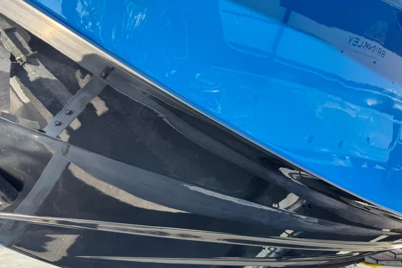 Slide: The Image of Close-up of a 2022 Scarab 285 ID boat hull in blue and black. - 103