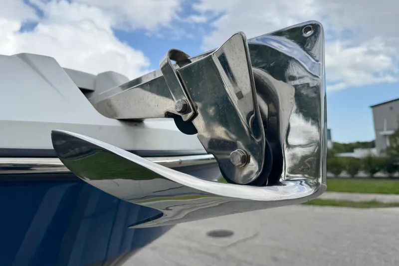 Slide: The Image of Close-up of a 2022 Scarab 285 ID boat anchor mechanism under a cloudy sky. - 11