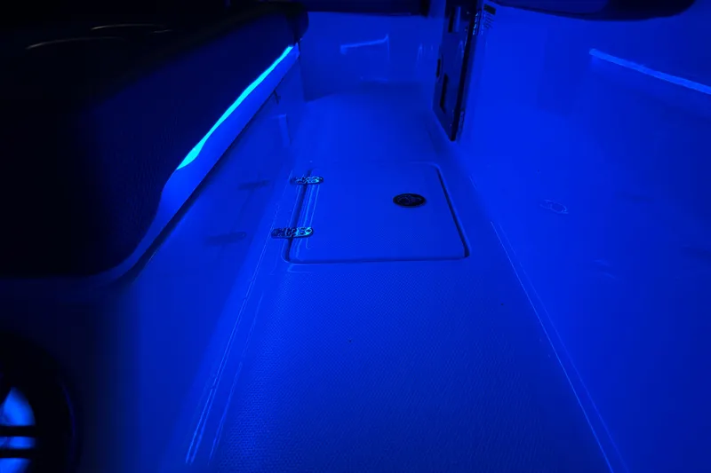 Slide: The Image of 2022 Scarab 285 ID boat interior with blue LED lighting. - 114