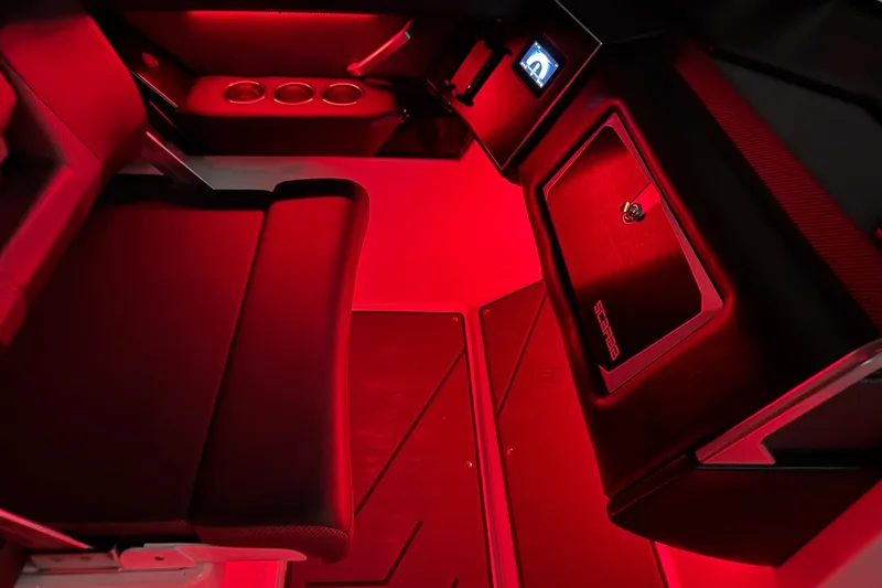 Slide: The Image of 2022 Scarab 285 ID boat interior with red ambient lighting and modern seating. - 119