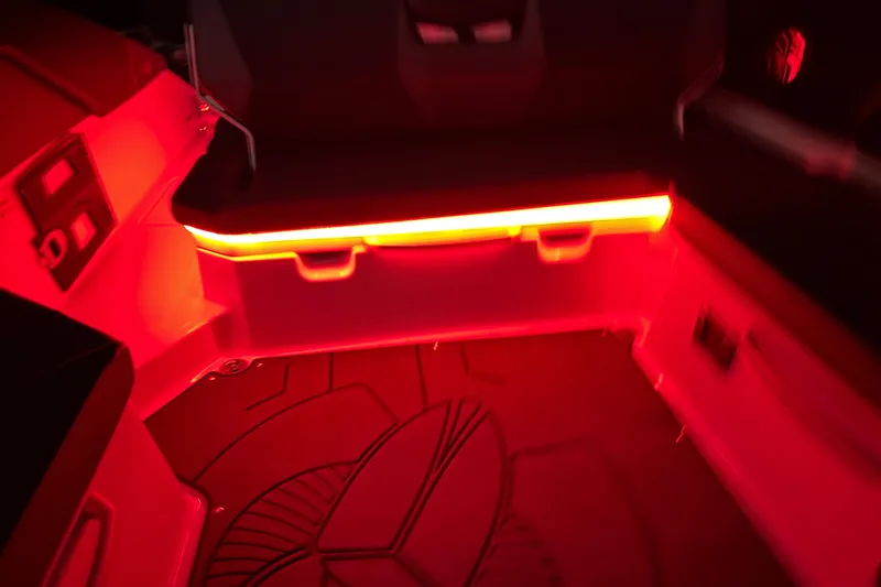 Slide: The Image of Interior of 2022 Scarab 285 ID boat with red ambient lighting. - 120