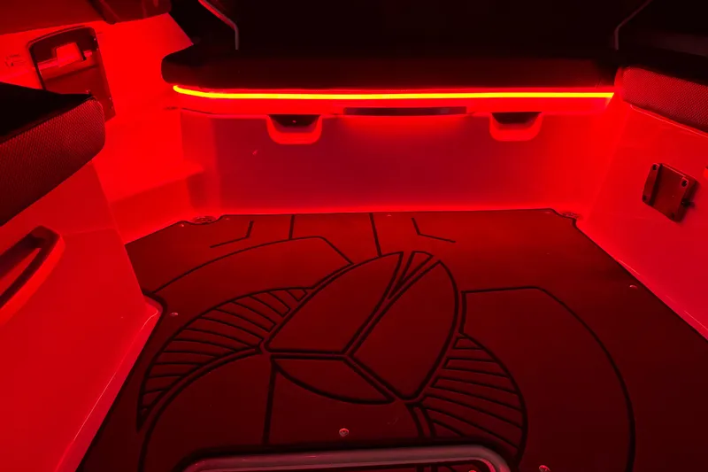 Slide: The Image of Interior of 2022 Scarab 285 ID boat with red LED lighting and custom flooring. - 121
