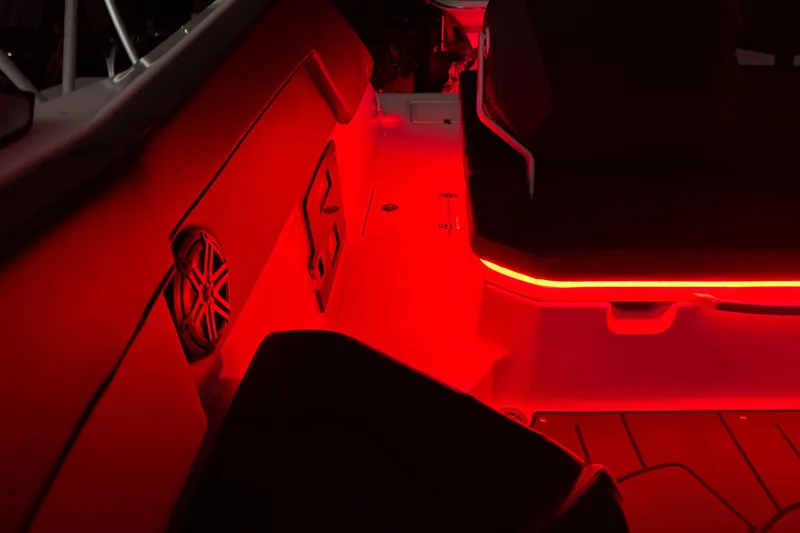Slide: The Image of Interior of 2022 Scarab 285 ID boat with red ambient lighting. - 122
