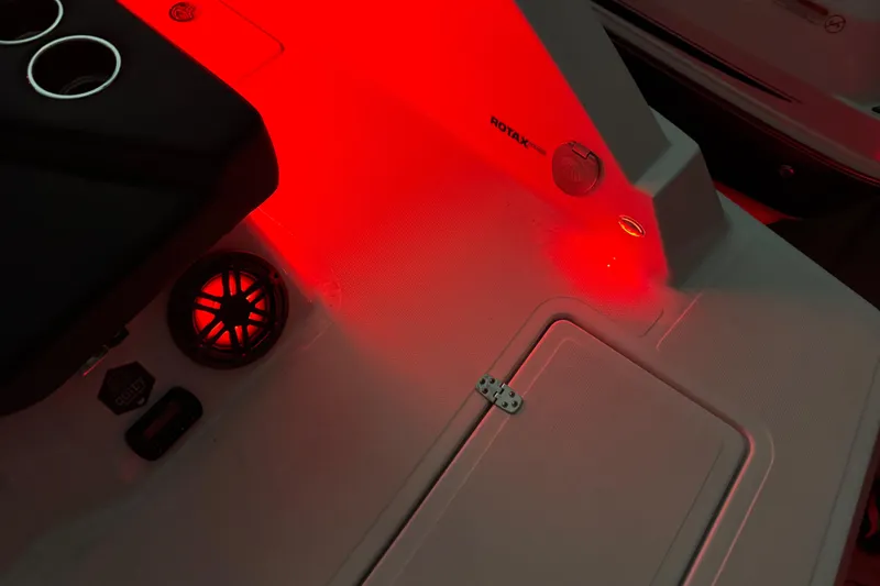 Slide: The Image of 2022 Scarab 285 ID boat interior with red LED lighting and speaker detail. - 125