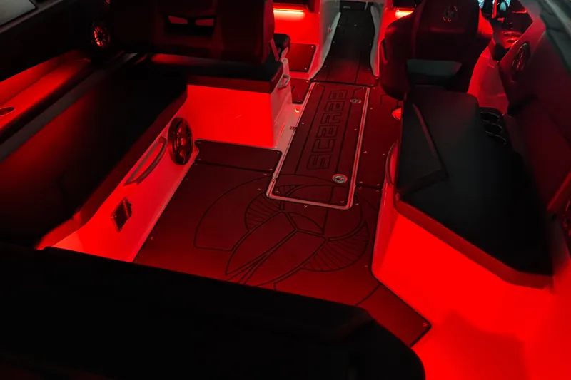 Slide: The Image of Interior of 2022 Scarab 285 ID boat with red ambient lighting. - 127