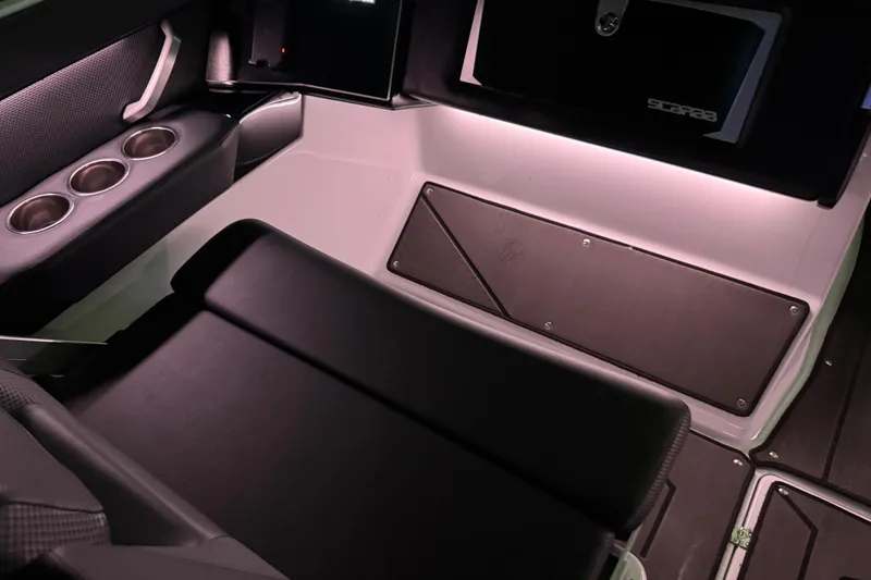 Slide: The Image of Interior of a 2022 Scarab 285 ID boat featuring sleek seating and cup holders. - 131