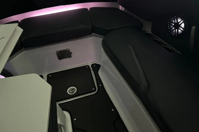 Slide: The Image of Interior of 2022 Scarab 285 ID boat with ambient lighting and cushioned seating. - 132
