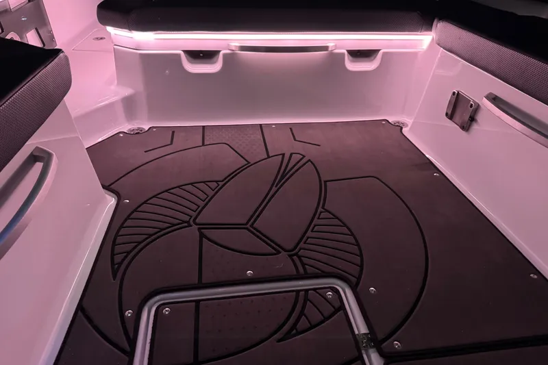 Slide: The Image of 2022 Scarab 285 ID boat interior with stylish flooring and ambient lighting. - 133