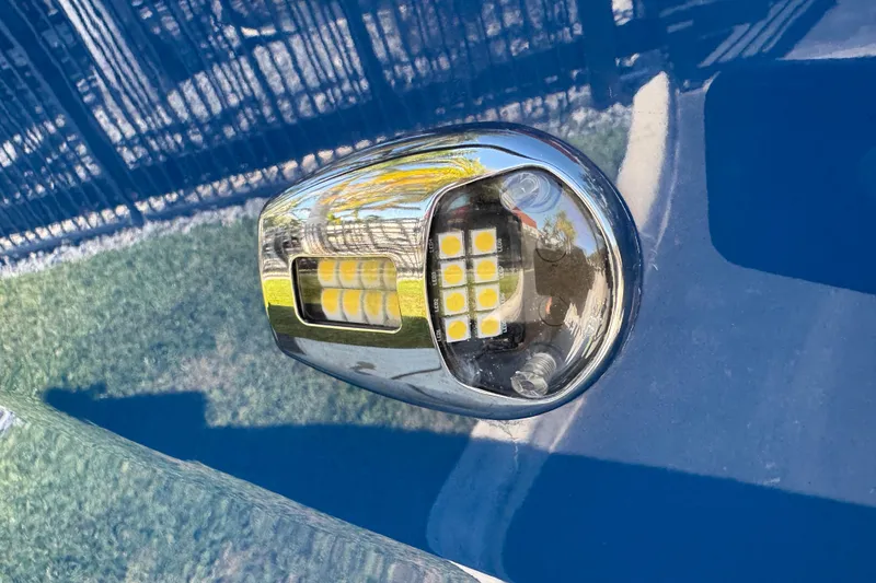 Slide: The Image of LED light on 2022 Scarab 285 ID boat, reflecting surroundings. - 15