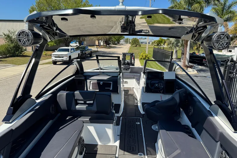 Slide: The Image of 2022 Scarab 285 ID boat interior with sleek seating and modern dashboard design. - 23