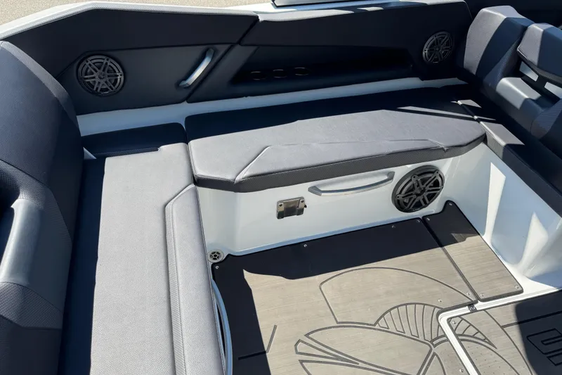 Slide: The Image of 2022 Scarab 285 ID boat interior with cushioned seating and built-in speakers. - 26