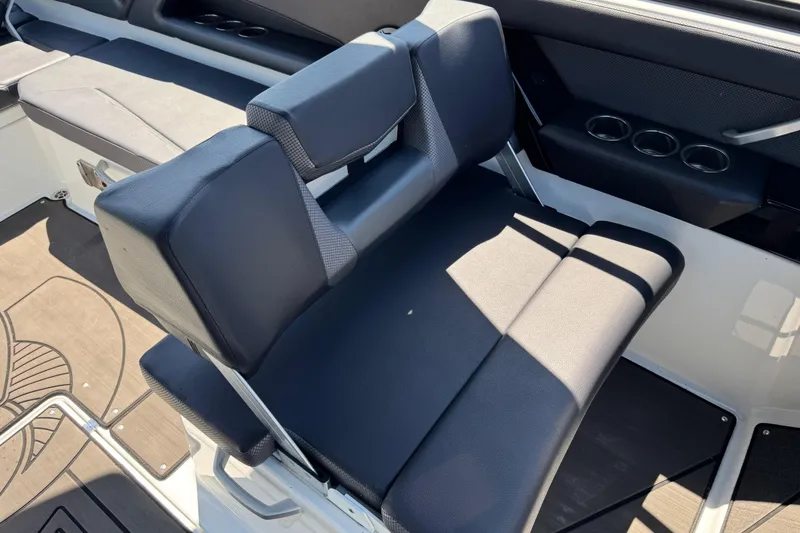 Slide: The Image of 2022 Scarab 285 ID boat seat with black upholstery and cup holders. - 29