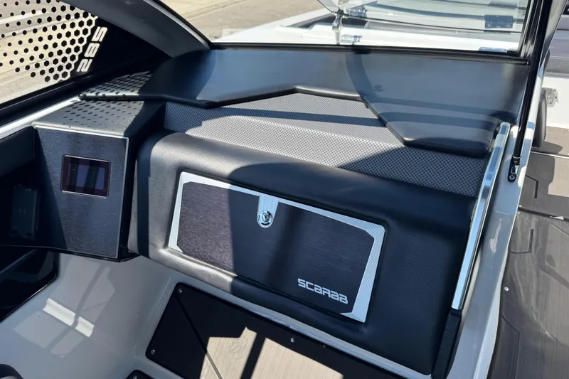 Slide: The Image of 2022 Scarab 285 ID boat interior with sleek dashboard and modern design elements. - 30