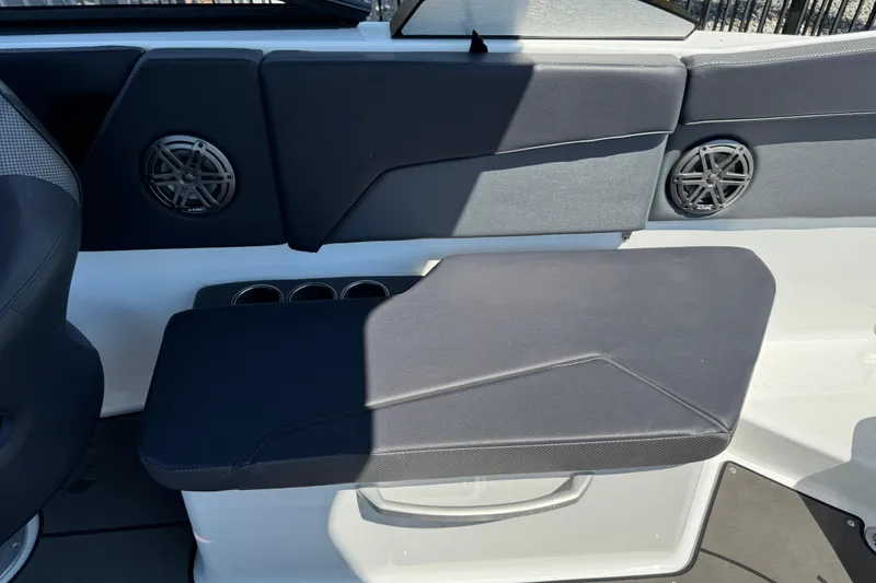 Slide: The Image of Interior seating of a 2022 Scarab 285 ID boat with speakers and cup holders. - 39