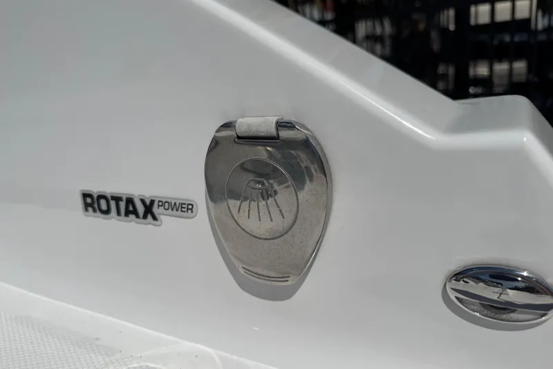 Slide: The Image of Close-up of 2022 Scarab 285 ID boat with Rotax power emblem. - 42