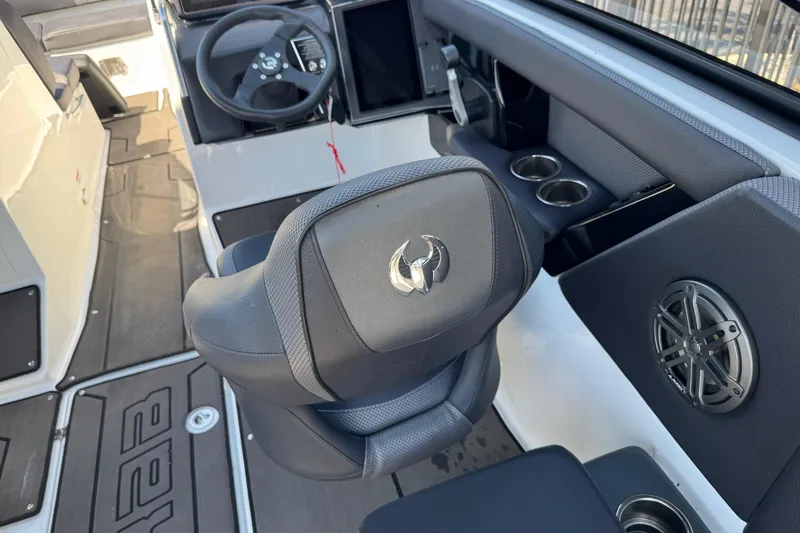 Slide: The Image of Interior of 2022 Scarab 285 ID boat featuring steering wheel and seating. - 44