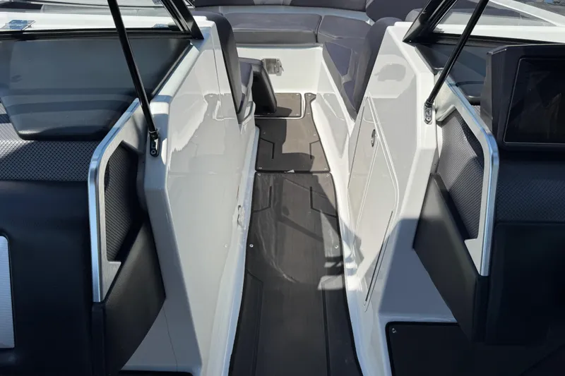 Slide: The Image of Interior view of 2022 Scarab 285 ID boat, featuring sleek design and modern seating. - 46