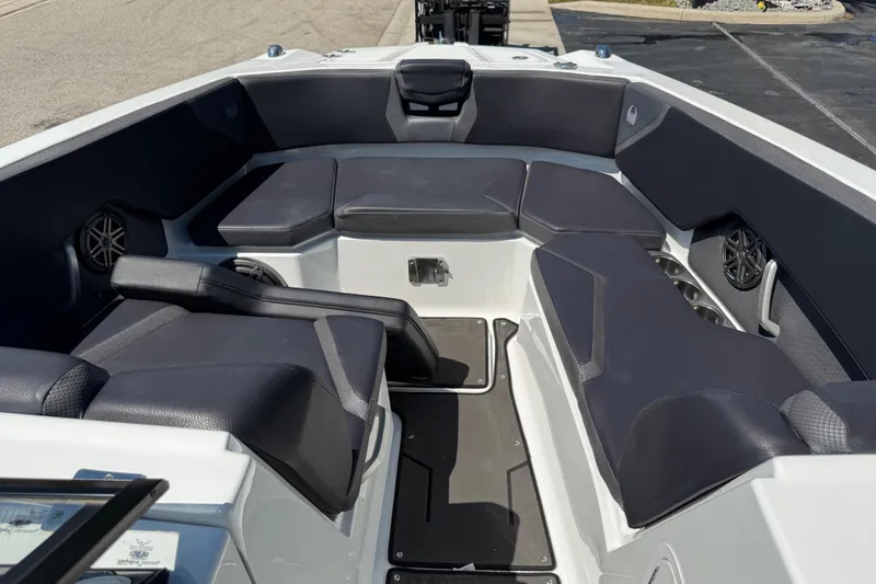 Slide: The Image of Interior of 2022 Scarab 285 ID boat with cushioned seating and speakers. - 49
