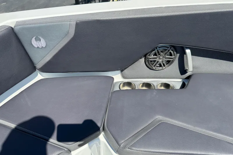 Slide: The Image of Interior seating of 2022 Scarab 285 ID boat with speaker and cup holders. - 51