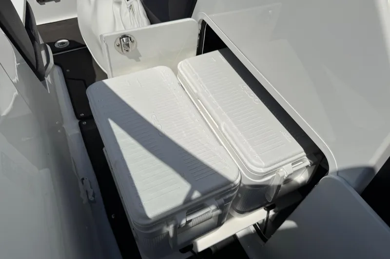 Slide: The Image of Storage compartment with coolers in a 2022 Scarab 285 ID boat. - 55
