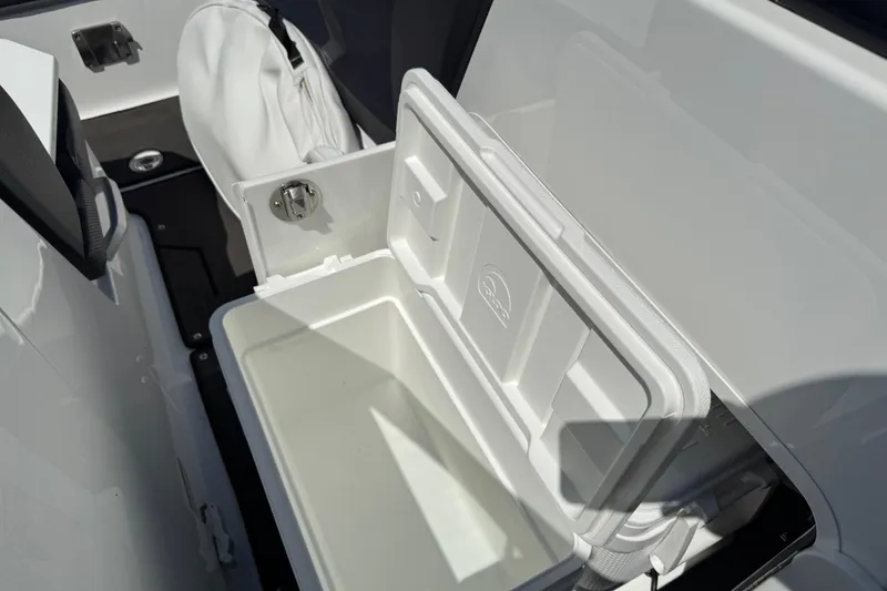 Slide: The Image of 2022 Scarab 285 ID boat interior with open storage compartment. - 56
