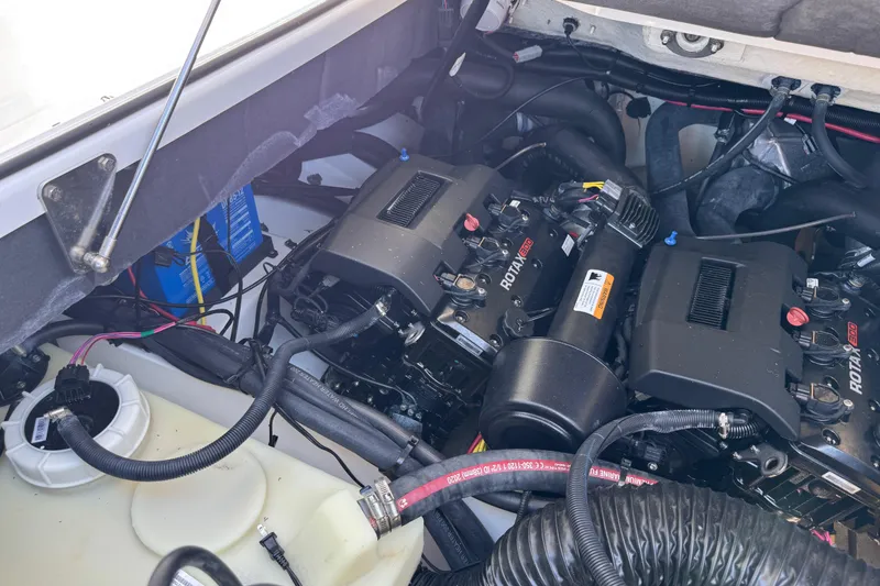 Slide: The Image of Engine compartment of a 2022 Scarab 285 ID boat featuring Rotax engines. - 62