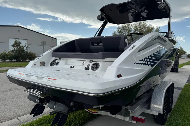 Slide: The Image of 2022 Scarab 285 ID boat on trailer, showcasing sleek design and modern features. - 7